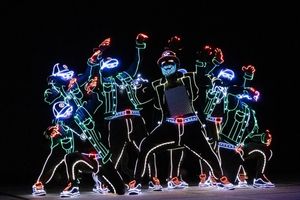 A photo of the members of Light Dance performing onstage at channel partners conference and expo