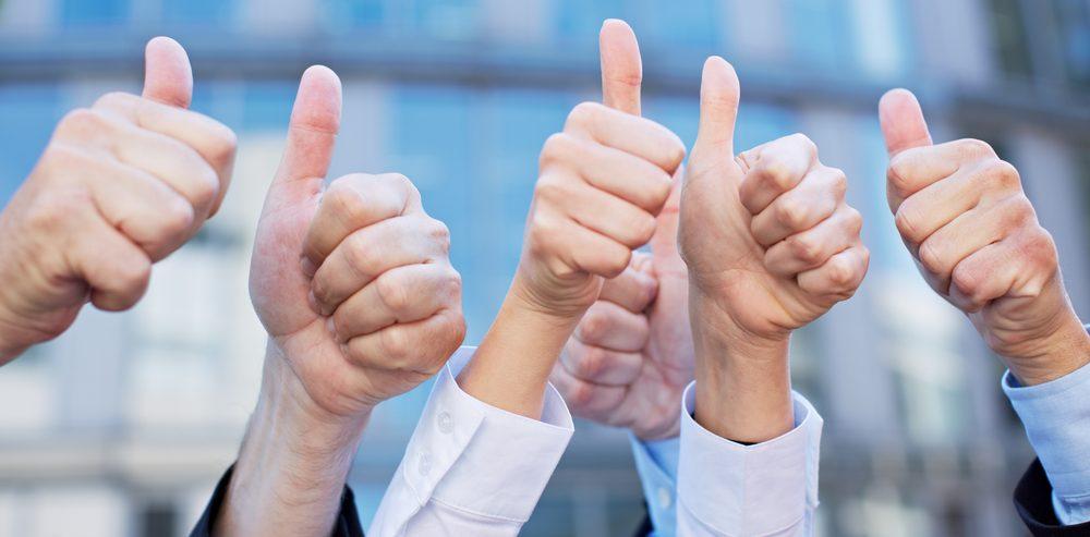 Businesspeople thumbs up Businesspeople thumbs up